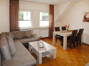 a living room with a couch and a table at Apartment Weingut Krempel by Interhome in Traben-Trarbach
