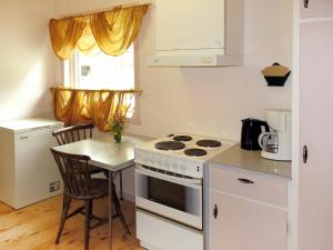 A kitchen or kitchenette at Holiday Home Olavbu - SOW105 by Interhome