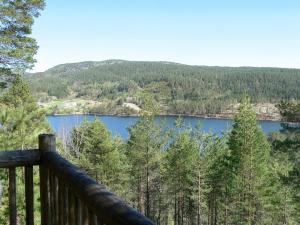 a view of a lake from a deck at Holiday Home Knutebu - SOW093 by Interhome in Øyuvstad