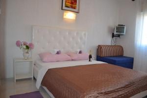 Łóżko lub łóżka w pokoju w obiekcie Villa Lanca
