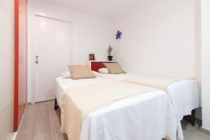 Posteľ alebo postele v izbe v ubytovaní Sea & Wave Mendoza Apartment