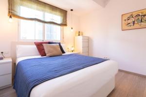 Posteľ alebo postele v izbe v ubytovaní Sea & Wave Mendoza Apartment