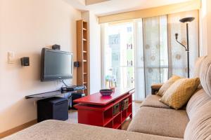 Televízia a/alebo spoločenská miestnosť v ubytovaní Sea & Wave Mendoza Apartment