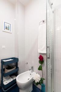 a bathroom with a sink and a toilet and a shower at SW Soho Family Apartment in Málaga