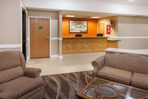a lobby with two chairs and a waiting room at Super 8 by Wyndham Rochester in Rochester
