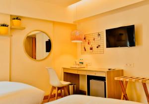 TV a/nebo společenská místnost v ubytování Bloom Hotel - Juhu