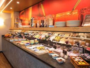 a buffet line with many different types of food at ibis Saarbrücken City in Saarbrücken