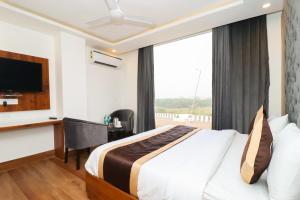 Postel nebo postele na pokoji v ubytování Hotel View - A Boutique Hotel
