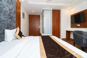 Postel nebo postele na pokoji v ubytování Hotel View - A Boutique Hotel