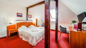 Łóżko lub łóżka w pokoju w obiekcie Karkonoski SPA - Bufet mini All Inclusive gratis!