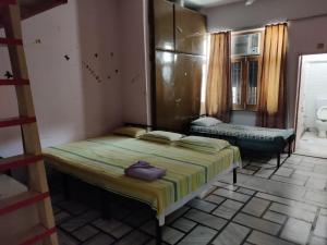 a bedroom with two beds in a room at House No 87A in Jaipur