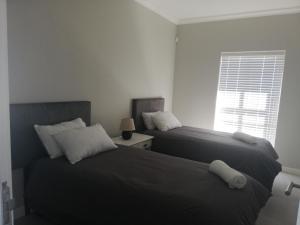 Cama ou camas em um quarto em 127 atlantic pearlbay yzerfontein