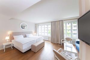 Postel nebo postele na pokoji v ubytování Geneva by Fassbind + 26 fotografií