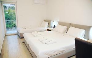 Ένα ή περισσότερα κρεβάτια σε δωμάτιο στο Vila Lux Nedeljkovic Gornja Trepca
