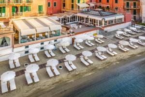 an aerial view of a beach with chairs and umbrellas at Hotel Miramare & Spa in Sestri Levante