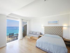 a hotel room with a bed and a table at Sunrise Beach Hotel in Protaras