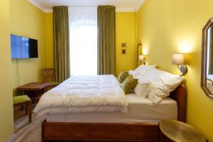 Posteľ alebo postele v izbe v ubytovaní Parkhotel Vrbno