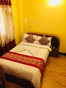 Postel nebo postele na pokoji v ubytování Hotel Green Orchid