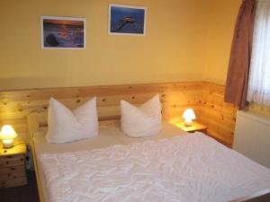 Katil atau katil-katil dalam bilik di Ferien im Gutspark Schwarbe mit Re
