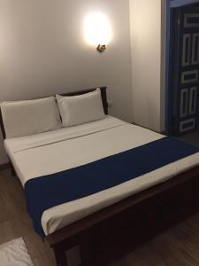 Una cama o camas en una habitación de Cinnamon Heaven