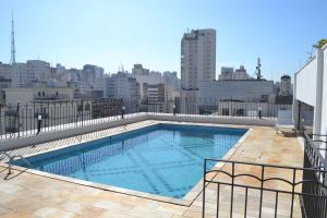 a swimming pool on the roof of a building at Flat Jd Paulista Residence in São Paulo