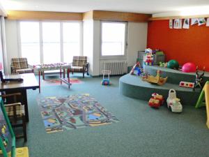 a childrens room with a play area with toys in it at Apartment Ringstrasse - Utoring-2 by Interhome in Leukerbad