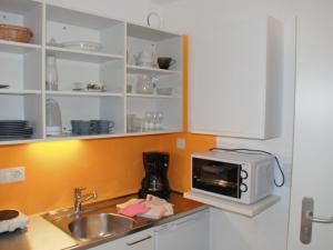 Kuhinja ili čajna kuhinja u objektu Apartment Corallo - Utoring-5 by Interhome