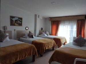 Postel nebo postele na pokoji v ubytování Hotel Mirador Plaza + 32 fotografií