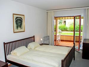 Postel nebo postele na pokoji v ubytování Apartment Residenza Parcolago Apt-008 by Interhome