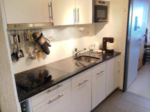 A kitchen or kitchenette at Apartment Utoring Acletta-63 by Interhome