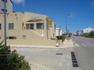 a building on the side of a street at Mira Fortaleza in Sagres