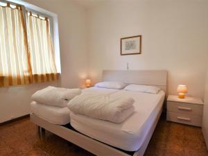 A bed or beds in a room at Holiday Home Villa Laura-5 by Interhome