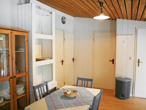 a dining room with a table with a bowl on it at Holiday Home Geesthof-1 by Interhome in Klint