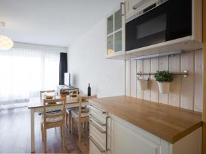 a kitchen with a table and a counter top at Studio Greppon 107 by Interhome in Les Collons +21 photos
