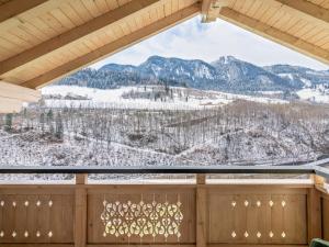 a view of a snowy mountain from a window at Apartment Achtalgut-1 by Interhome in Lend