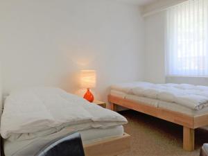 Apartment Matten - Utoring-15 by Interhomeにあるベッド