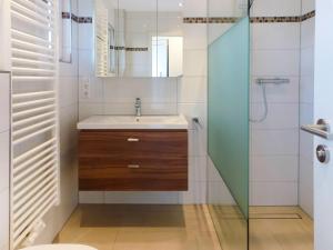 a bathroom with a sink and a shower at Holiday Home Mily by Interhome in Dittishausen