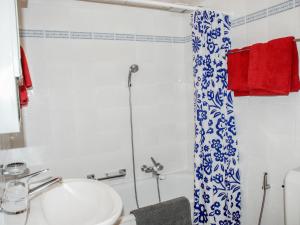 a bathroom with a sink and a shower at Apartment Residenza Corallo-16 by Interhome in Ascona +10 photos