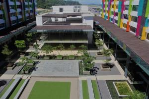 an aerial view of the courtyard of a building at Aeropod KK Corner Unit Near City and Airport 4 pax Free Parking in Kota Kinabalu