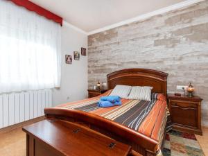 Tempat tidur dalam kamar di Holiday Home Figaro by Interhome