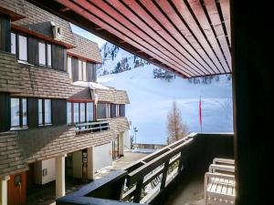 a view from a window of a building with a ski slope at Studio Greppon 111 by Interhome in Les Collons
