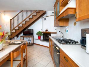 a kitchen with a sink and a stove at Holiday Home Laura by Interhome in Vercana