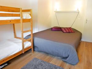 a bedroom with two bunk beds and a ladder at Apartment Les Bruyères 25 by Interhome in Chesières +14 photos