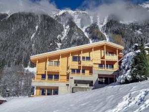 a wooden building on top of a snow covered mountain at Apartment Bab-Port by Interhome in Wengen