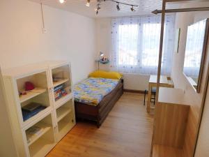 Кровать или кровати в номере Apartment Bennico by Interhome