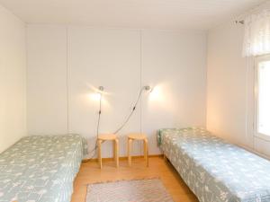 Postel nebo postele na pokoji v ubytování Holiday Home Hiekkalampi by Interhome