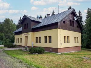 a large building with a gambrel roof with at Chalet Karlovka by Interhome in Hrabětice