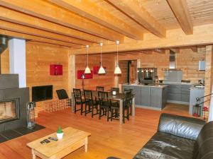 a living room with a dining room and a kitchen at Apartment Alpina Apt- CH by Interhome in Wengen +18 photos