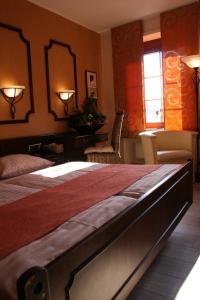 
Ein Bett oder Betten in einem Zimmer der Unterkunft Le Pavillon
