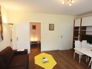 a living room with a couch and a table at Apartment Schlossalmblick by Interhome in Bad Hofgastein